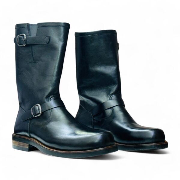 Side Profile: 1990s-style black biker boots with a sleek and sturdy design.