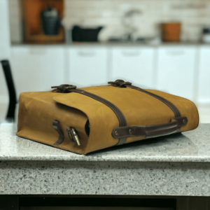 This multi-functional leather bag is perfect for the modern man on the go. With its sturdy construction, it can hold a laptop, books, and essentials for work or school. The cross-body design keeps hands free while the leather adds a touch of sophistication. Stay organized and stylish with this versatile briefcase.