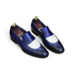 Classic handcrafted men’s loafers in contrasting blue and white tones.